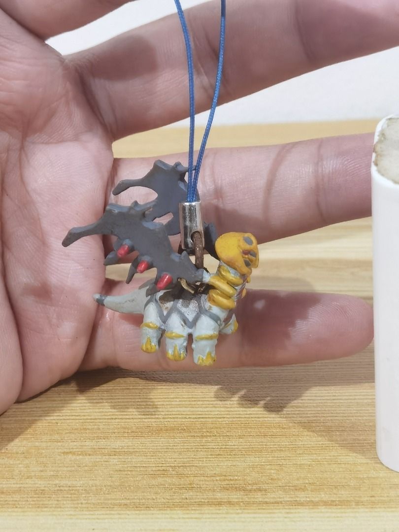 Pokemon - Giratina Figure Charm (Category: Character Goods) located in Taguig. Submitted by kalabasza (Listing ID 1463567877, Image 2). Description: 📌 This is a preloved item. Please manage your expectation. 📌 Actual item posted. 📌 Rusty po metal niya. As is. 📌 Product Color may slightly vary due to Photographic Lighting. 📌 Location: Taguig 📌 MOP: GCash. Payment first before ship. 📌 MOD: J&T, LBC, GoGo or Lalamove. 📌 DF/SF at buyer's expe