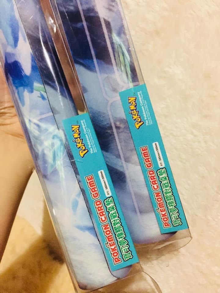POKEMON TCG Playmat (Category: Trading Cards Accessories) located in Baguio. Submitted by izza_thrifty (Listing ID 1463663736, Image 3). Description: -380 each, 2 pcs available - Pokemon Card Game Playmat featuring Lugia artwork. - Includes original packaging tube and box. - Dimensions: 610mm x 350mm. - Ideal accessory for any Pokemon TCG fan..