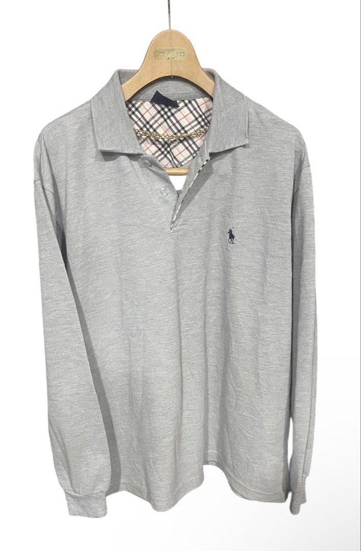 POLO Long Sleeve Polo Shirt (Category: Tshirts & Polo Shirts ) located in San Pedro. Submitted by lifebeginsaftercoff33 (Listing ID 1463697507, Image 2). Description: - POLO Longsleeve - Color: Grey - Style: Long Sleeve Polo Shirt - Size: XL on tag - Dimes: 22 x 27 in - Material: 100% Cotton - Features: Classic polo collar, embroidered chest logo, plaid pattern on inner collar lining - Occasion: Casual wear - very soft comfy stretchy thick fabric