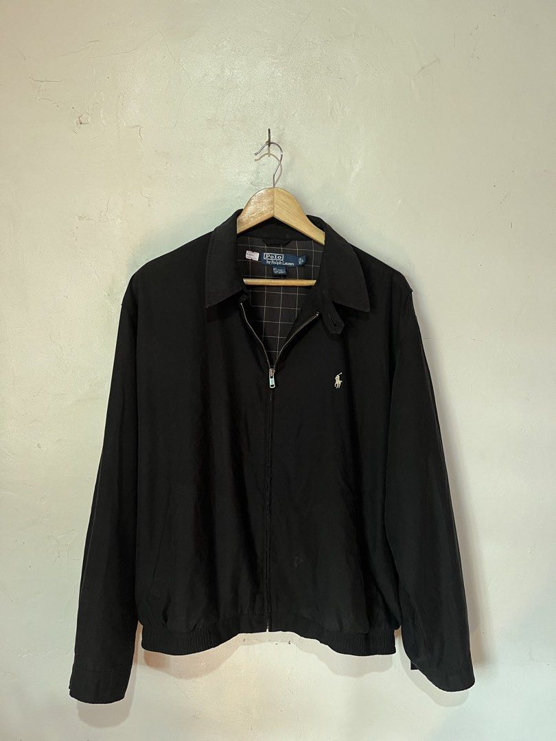 Polo Ralph Lauren Black Harrington Jacket (Category: Coats, Jackets and Outerwear) located in Quezon. Submitted by goodthrifts01 (Listing ID 1463574477, Image 1). Description: - Legit Classic Bi-Swing Polo Ralph Lauren jacket - Iconic embroidered polo player logo on chest - Subtle plaid pattern lining - 100% Polyester shell - 100% Cotton lining - Size: Large L-xl -Issue: minor scratch and small hole .