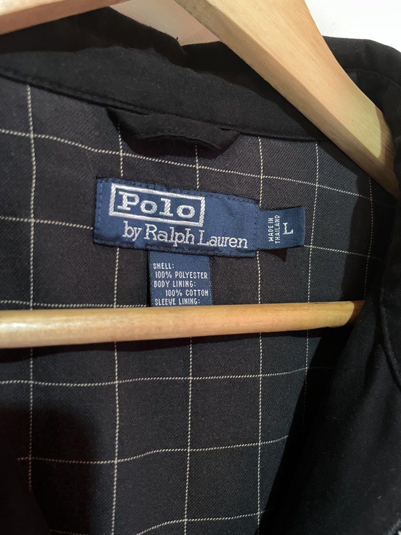 Polo Ralph Lauren Black Harrington Jacket (Category: Coats, Jackets and Outerwear) located in Quezon. Submitted by goodthrifts01 (Listing ID 1463574477, Image 3). Description: - Legit Classic Bi-Swing Polo Ralph Lauren jacket - Iconic embroidered polo player logo on chest - Subtle plaid pattern lining - 100% Polyester shell - 100% Cotton lining - Size: Large L-xl -Issue: minor scratch and small hole .