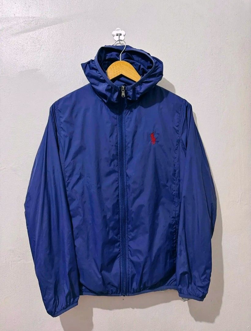 Polo Ralph Lauren Blue Hooded Jacket (Category: Coats, Jackets and Outerwear) located in Manila. Submitted by louiefinds26 (Listing ID 1463662981, Image 1). Description: - Blue hooded jacket from Polo Ralph Lauren - Iconic red pony logo on chest - Zipper closure with RL branded pull - Lightweight material, ideal for layering - Size medium - Great for casual wear or outdoor activities.