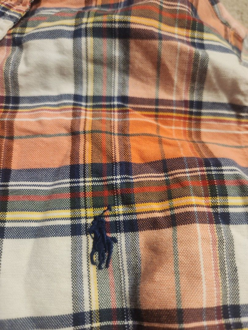 Polo Ralph Lauren Plaid Button Down Shirt (Category: Tshirts & Polo Shirts ) located in Cabuyao City. Submitted by hd.mnnnnn (Listing ID 1463668892, Image 3). Description: 20x27 - Classic plaid button-down shirt by Polo Ralph Lauren - Signature pony logo embroidered on chest - Color: Orange, white, navy, and yellow plaid pattern - Button-up front and collar - Versatile for casual wear or layering.