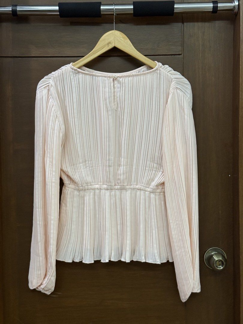 Pomelo Pink Pleated Long Sleeve Top (Category: Blouses) located in Tarlac. Submitted by samdeclutters_ (Listing ID 1463660885, Image 2). Description: - Size: Small - Color: Pink - Fabric: Lightweight plissé, pleated - Never worn, only washed once.