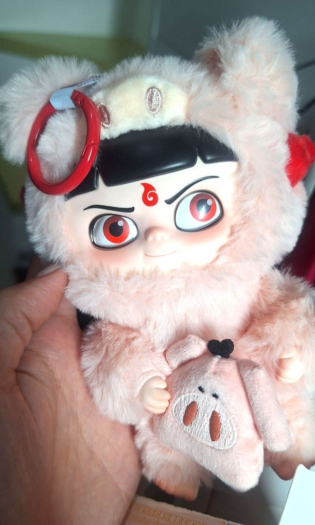 Pop Mart Nezha 2 Blind Box Toy (Category: Designer & Blind Box Toys) located in Quezon City. Submitted by tinylittlecorner (Listing ID 1463579331, Image 3). Description: - Pop Mart Nezha 2 blind box toy - Fluffy pink Pig edition - Comes with original packaging - Includes inner foil bag - Selling as is Bought in Hong Kong Feb 2026.