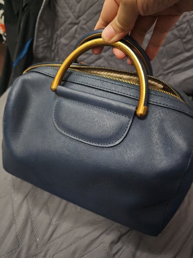 Prada 2way bag (Category: Cross-body Bags) located in Manila. Submitted by shopaholicmimi (Listing ID 1463693650, Image 3). Description: preloved prada saffiano bag minor flaws as seen on photos with replaced sling provided😊 not coach, erfo, legacy, soho, vintage, gucci, chanel, lv,.