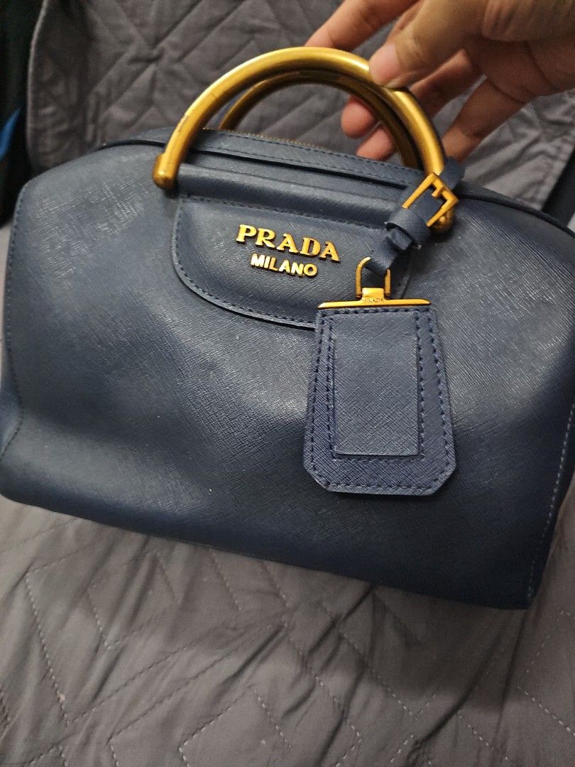 Prada 2way bag (Category: Cross-body Bags) located in Manila. Submitted by shopaholicmimi (Listing ID 1463693650, Image 1). Description: preloved prada saffiano bag minor flaws as seen on photos with replaced sling provided😊 not coach, erfo, legacy, soho, vintage, gucci, chanel, lv,.