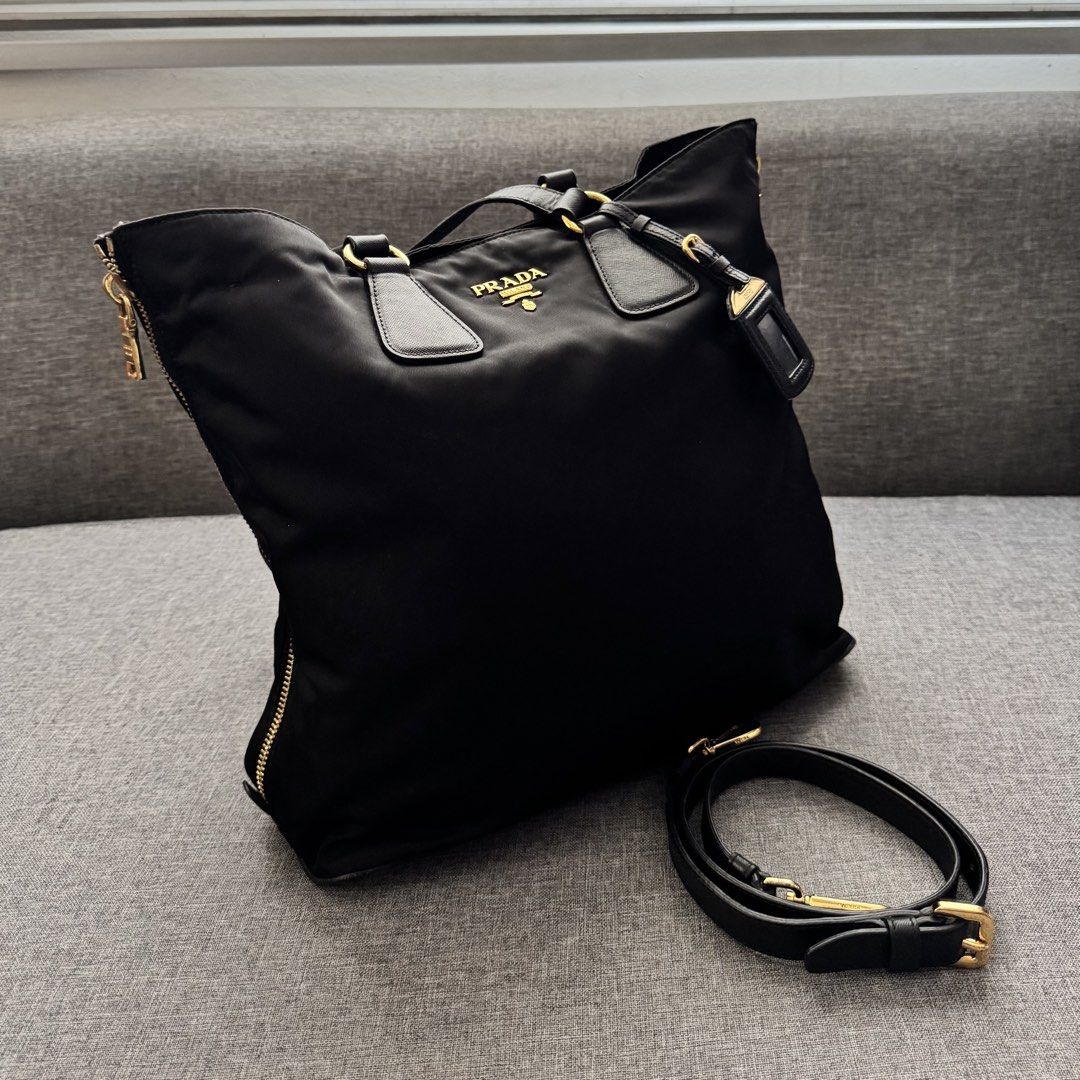 Prada Black Nylon Tote Bag (Category: Tote Bags) located in Tanza. Submitted by edzelg5r62292 (Listing ID 1463614462, Image 1). Description: Dimensions: Length: 13 inches Width: 16 inches 9/10 condition normal signs of use missing white and black tags minimal tarnish on hardwares small rubs on one side what you see is what you get with provided dustbag.