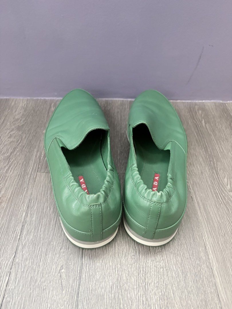 Prada Green Leather Slip-On Shoes (Category: Casual Shoes) located in Pasig City. Submitted by tepdorotheo (Listing ID 1463615129, Image 3). Description: - Vibrant green, yellow and light blue Prada slip-on shoes - Made from soft leather and suede - Elasticated sides for a comfortable fit - Green soles with a small red Prada tab - Ideal for casual wear -size 38.5.