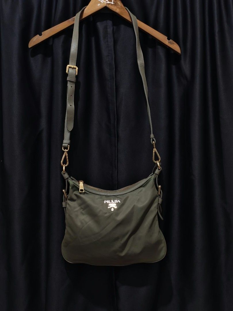 Prada Nylon Shoulder Bag Khaki Gold Hardware (Category: Luxury Bags & Wallets) located in Baguio. Submitted by solo_ukay (Listing ID 1463695821, Image 1). Description: - Authentic Prada shoulder bag - Durable nylon with leather trim - Gold-tone hardware - Secure zip closure - Branded interior lining - Interior tag reads '209' - Adjustable strap for comfort - Ideal for everyday use.