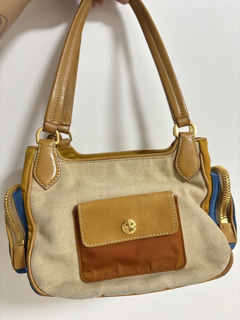 Prada Tessuto Nylon Canvas Shoulder Bag y2k cargo (Category: Luxury Bags & Wallets) located in Bulacan. Submitted by ricammendz (Listing ID 1463693152, Image 3). Description: No-hanggle last price posted - Authentic Prada bag -with flaw see last photo - Combination of canvas and nylon material - Tan leather trim and handles - Multiple zippered pockets - Comes with authenticity cards and dust bag - Great for everyday use.