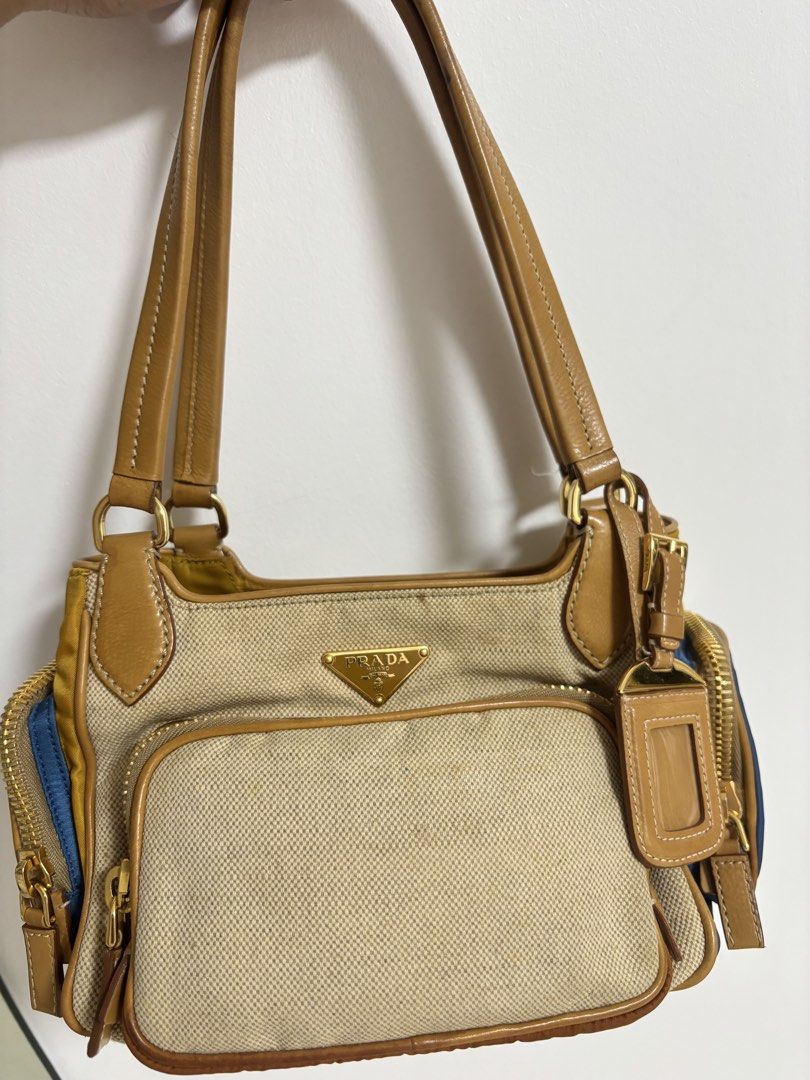 Prada Tessuto Nylon Canvas Shoulder Bag y2k cargo (Category: Luxury Bags & Wallets) located in Bulacan. Submitted by ricammendz (Listing ID 1463693152, Image 2). Description: No-hanggle last price posted - Authentic Prada bag -with flaw see last photo - Combination of canvas and nylon material - Tan leather trim and handles - Multiple zippered pockets - Comes with authenticity cards and dust bag - Great for everyday use.