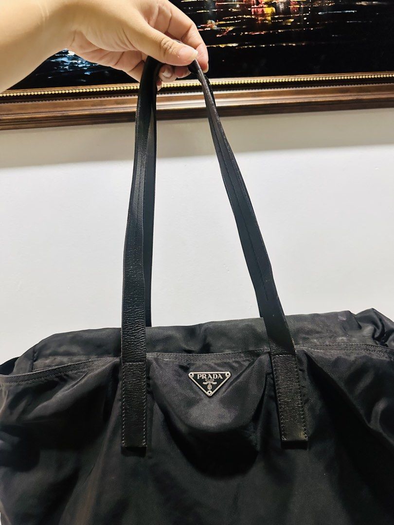 Prada Tessuto Nylon Tote bag (Category: Tote Bags) located in Batangas. Submitted by stopandshopforluxury (Listing ID 1463736340, Image 2). Description: Guaranteed Original 💯 No flaws, can send more photos upon request. What you see is what you get. Shipping via Lalamove, J&T, and LBC Disclaimer: This is a preloved bag. Actual condition is shown in photos. Expect normal signs of wear. Colors may slightly vary due to lighting. Please check all ph
