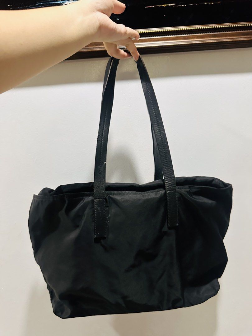 Prada Tessuto Nylon Tote bag (Category: Tote Bags) located in Batangas. Submitted by stopandshopforluxury (Listing ID 1463736340, Image 3). Description: Guaranteed Original 💯 No flaws, can send more photos upon request. What you see is what you get. Shipping via Lalamove, J&T, and LBC Disclaimer: This is a preloved bag. Actual condition is shown in photos. Expect normal signs of wear. Colors may slightly vary due to lighting. Please check all ph