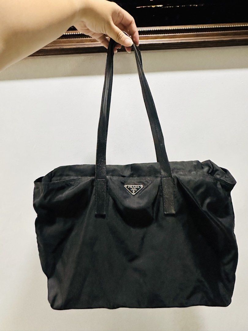 Prada Tessuto Nylon Tote bag (Category: Tote Bags) located in Batangas. Submitted by stopandshopforluxury (Listing ID 1463736340, Image 1). Description: Guaranteed Original 💯 No flaws, can send more photos upon request. What you see is what you get. Shipping via Lalamove, J&T, and LBC Disclaimer: This is a preloved bag. Actual condition is shown in photos. Expect normal signs of wear. Colors may slightly vary due to lighting. Please check all ph