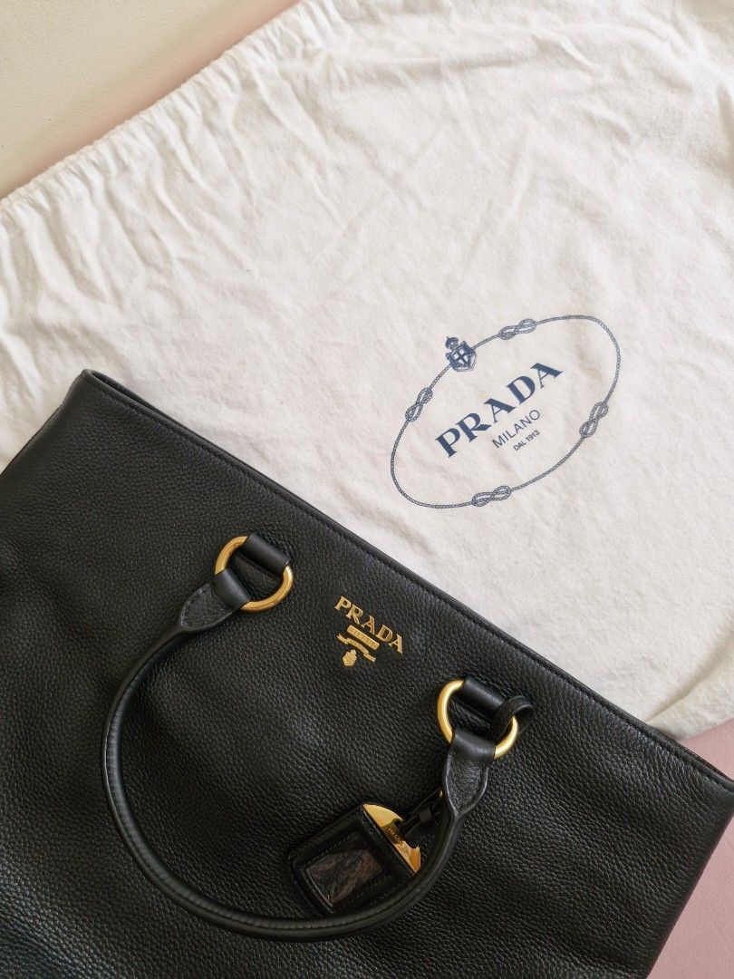PRADA Tote Bag (Category: Luxury Bags & Wallets) located in Taguig. Submitted by sarahlacsina18 (Listing ID 1463652187, Image 1). Description: Preloved Authentic PRADA Tote bag with certificate of authenticity, dust bag additional photos can be sent by request.