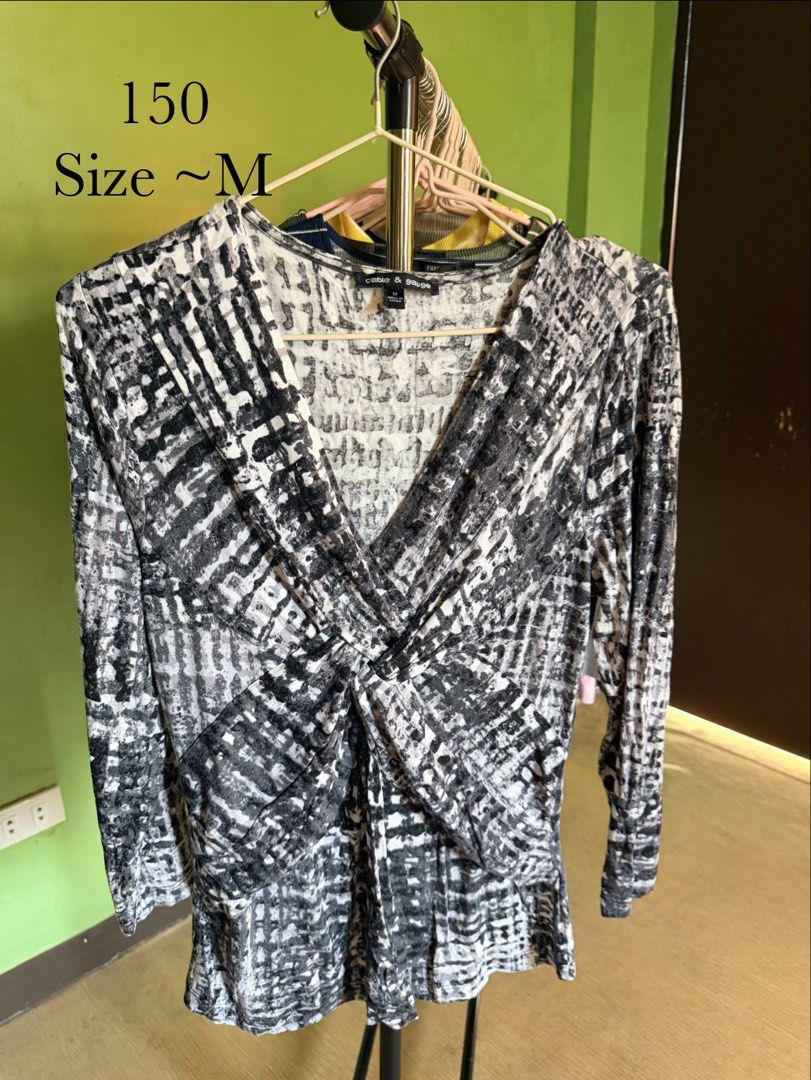 Print Twist Front Top (Category: Blouses) located in Muntinlupa City. Submitted by cocofinds023 (Listing ID 1463713001, Image 1). Description: - Brand: Cable & Gauge - Size: Medium (M) - Design: Abstract black and white print - Features: Flattering twist front detail, long sleeves - Style: Versatile for casual wear or dressing up.