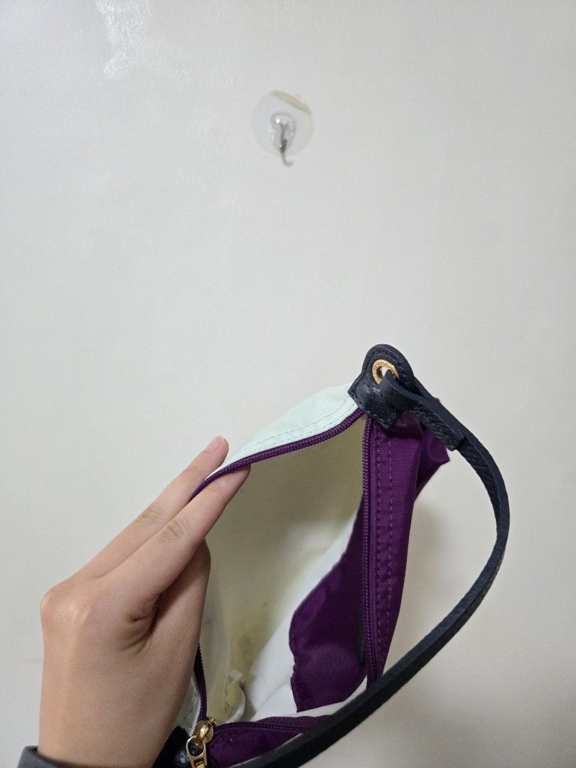 Purple and Mint Green Pouch Bag (Category: Purses & Pouches) located in Cagayan de Oro. Submitted by itsnaja (Listing ID 1463686765, Image 3). Description: - Cute pouch with purple exterior and mint green interior. - Zipper closure and black strap. - Small stain on the mint green interior (visible in the last photo). - Perfect for organizing small essentials. needs cleaning! perf kili kili bag & spacious rfs: dont use this as much!.