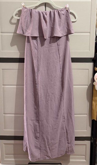 Purple Off-Shoulder Maxi Dress (Category: Dresses) located in Imus. Submitted by ann.declutters22 (Listing ID 1463597045, Image 1). Description: - can fit small to medium frame - Light purple off-shoulder maxi dress - Textured fabric - Ruffle detail at the bust - Simple and chic design - Great for events or a night out - Fits well.