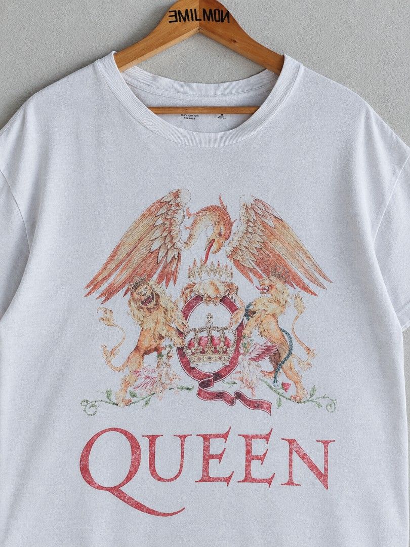 Queen Band T-Shirt (Category: Tshirts & Polo Shirts ) located in Palayan City. Submitted by akhai420 (Listing ID 1463666878, Image 2). Description: - White t-shirt featuring the iconic Queen crest graphic. - Print has a stylish, slightly distressed look. - Made from comfortable cotton material. - Ideal for casual wear. - A must-have for any Queen fan!.