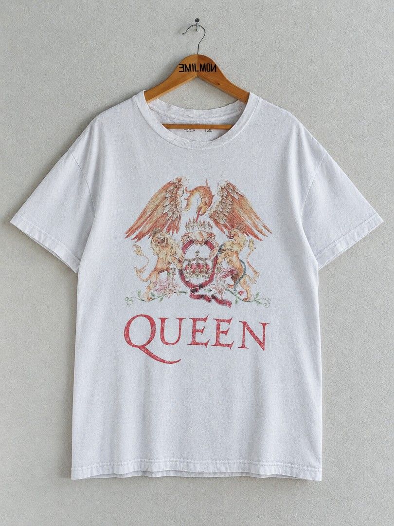 Queen Band T-Shirt (Category: Tshirts & Polo Shirts ) located in Palayan City. Submitted by akhai420 (Listing ID 1463666878, Image 1). Description: - White t-shirt featuring the iconic Queen crest graphic. - Print has a stylish, slightly distressed look. - Made from comfortable cotton material. - Ideal for casual wear. - A must-have for any Queen fan!.