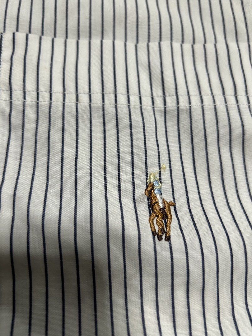Ralph lauren pin stripe button down tri-color pony (authentic) (Category: Tshirts & Polo Shirts ) located in Trece Martires City. Submitted by flip_flips (Listing ID 1463707377, Image 2). Description: Ralph lauren pin stripe button down tri-color pony (authentic) -Dimes 24 width 30 length -Excellent condition -9.5/10 color rate -issue: 1 pinhole.