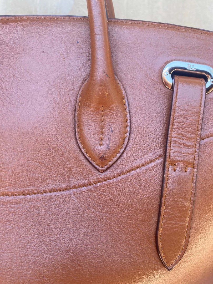 Ralph Lauren Ricky Bag 33 (Category: Luxury Bags & Wallets) located in Caloocan City. Submitted by thon0806 (Listing ID 1463652462, Image 3). Description: - Authentic Ralph Lauren brown leather satchel bag - Made in Italy - Secure turn-lock closure - Comfortable top handles - Minor scuffs on bottom corners - Small mark on one handle - Clean interior - Ideal for everyday use.