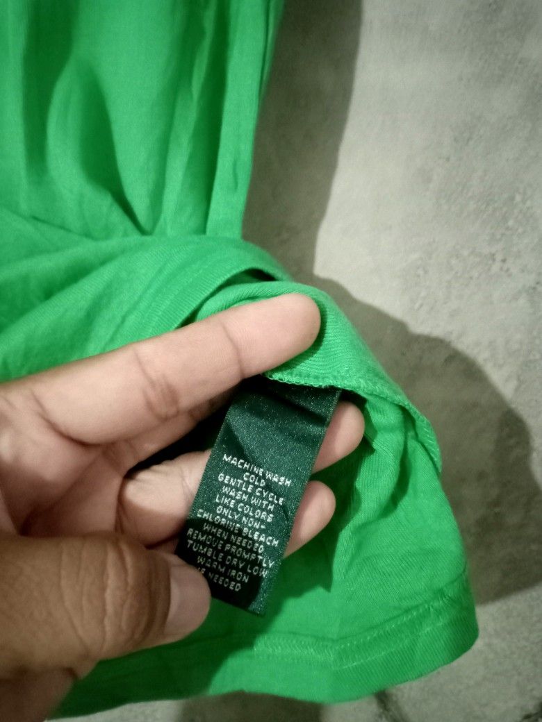 Ralph Lauren Women's (Category: Blouses) located in Manila. Submitted by boldfalcon.38de78 (Listing ID 1463646430, Image 3). Description: This is a bright green short-sleeve scoop-neck t-shirt by Lauren Ralph Lauren featuring a subtle embroidered RL monogram logo on the chest Ralph Lauren Women's As new Condition Size M W -16 ' L-24.5 10/10 Color rate No issue Location Davao city Gcash payment J&T Courier Php 450 + sf DM 💌.