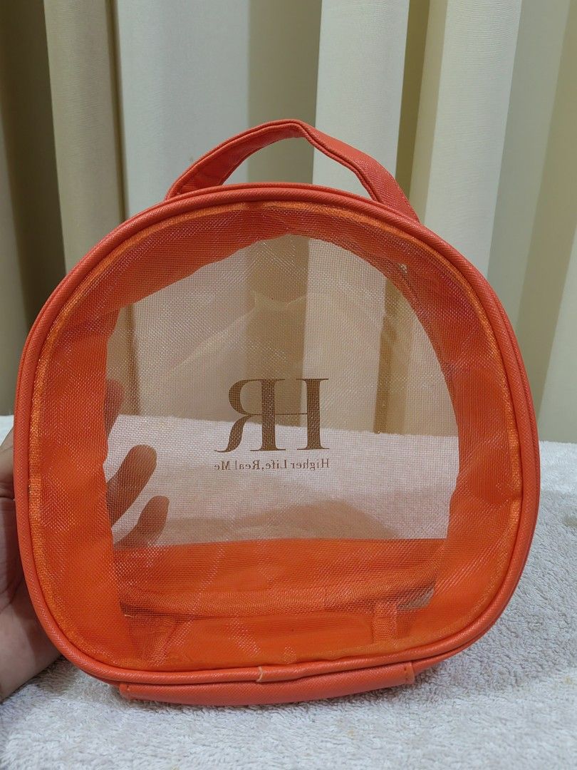Real Me Orange Mesh Cosmetic Bag (Category: Purses & Pouches) located in Makati City. Submitted by prelovedtreatedwithlove (Listing ID 1463739371, Image 2). Description: - Vibrant orange cosmetic bag - Clear mesh front for easy visibility - Secure zipper closure - Convenient top handle for carrying - Ideal for organizing makeup, toiletries, or travel essentials - Easy to clean material - Compact size, perfect for on-the-go - like new .