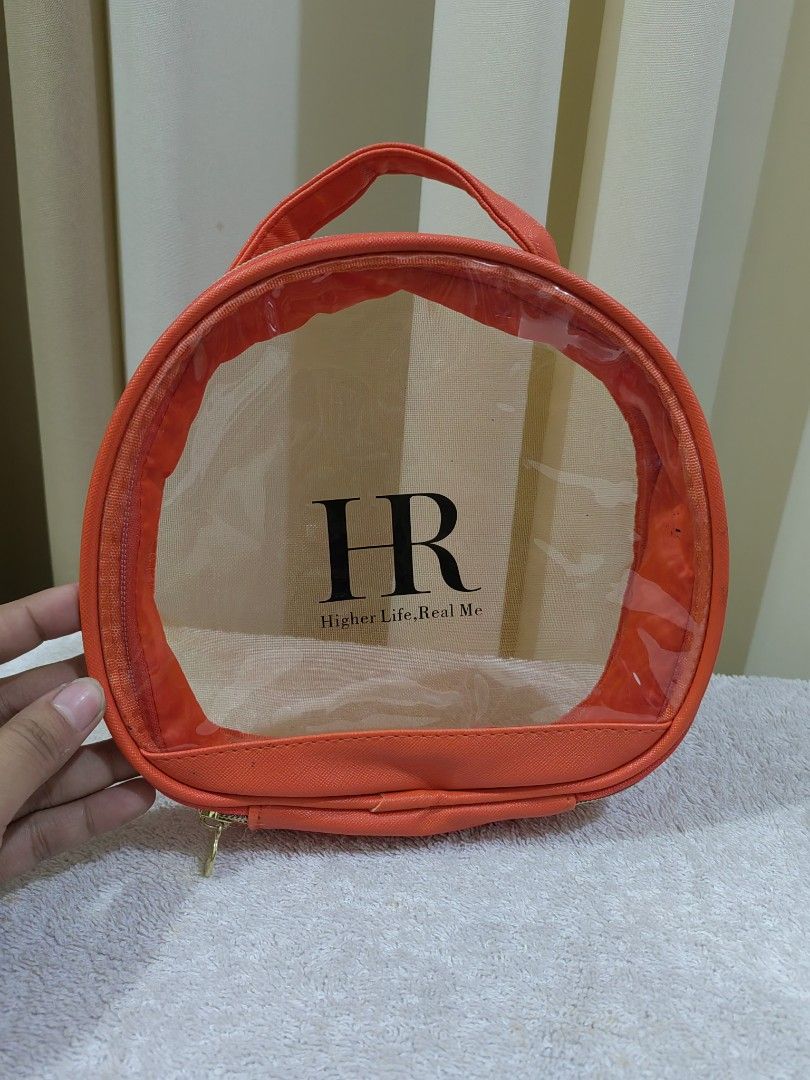 Real Me Orange Mesh Cosmetic Bag (Category: Purses & Pouches) located in Makati City. Submitted by prelovedtreatedwithlove (Listing ID 1463739371, Image 1). Description: - Vibrant orange cosmetic bag - Clear mesh front for easy visibility - Secure zipper closure - Convenient top handle for carrying - Ideal for organizing makeup, toiletries, or travel essentials - Easy to clean material - Compact size, perfect for on-the-go - like new .
