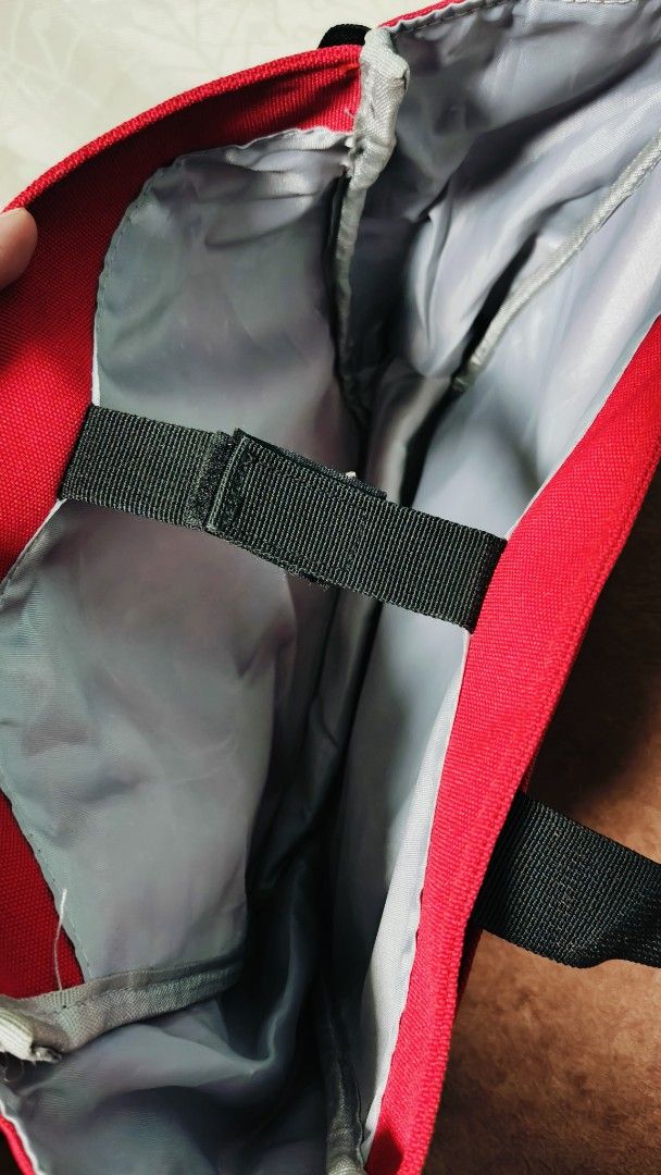 Red & Black Book Bag and Shoulder Strap (Category: Tote Bags) located in Manila. Submitted by serenitycarlylle (Listing ID 1463725593, Image 2). Description: - Eye-catching bright red tote bag - Features a prominent K logo emblem - Accented with blue and white stripes - Stylish black trim - Convenient side mesh pockets - Includes a detachable shoulder strap for versatility - Interior divider with a velcro strap for organization - Ideal for carryi