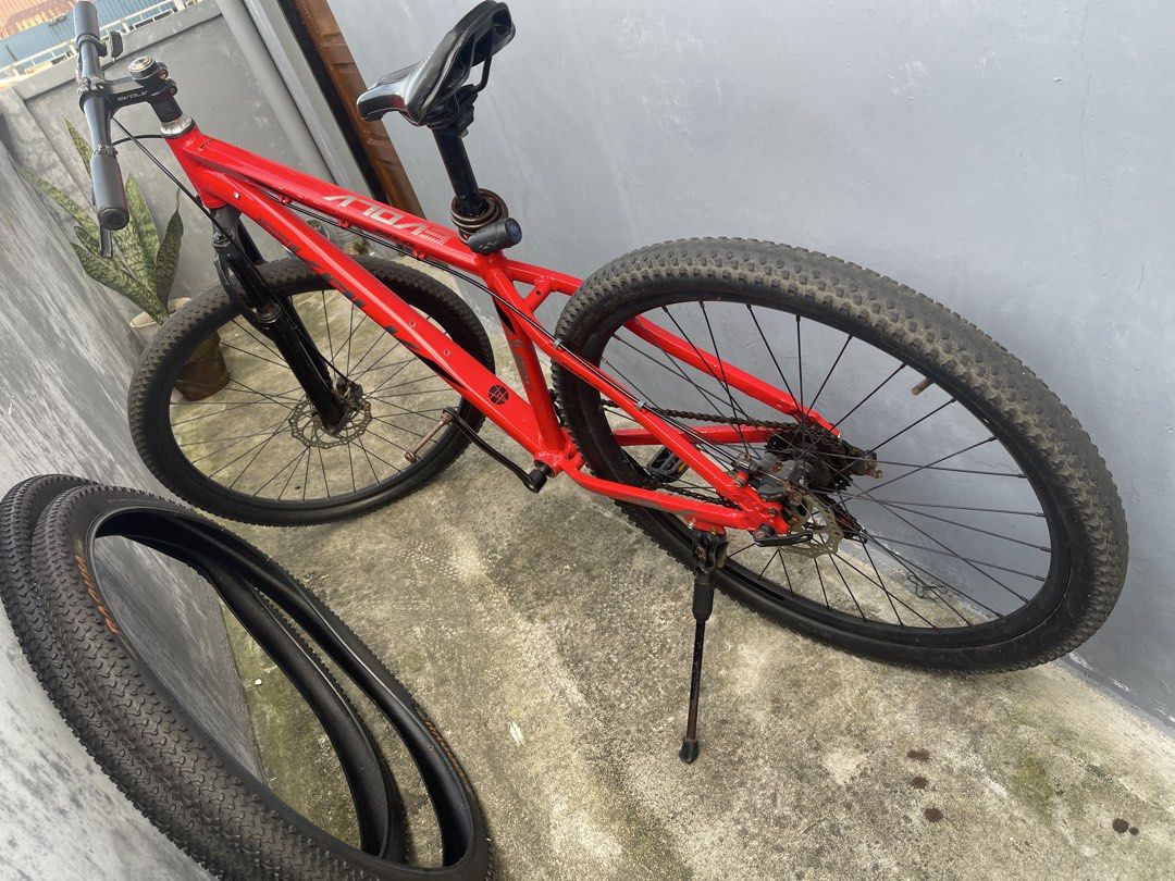 Red ATOM Mountain Bike (Category: Bicycles) located in Malabon City. Submitted by cosmicowl.309855 (Listing ID 1463588892, Image 1). Description: - Red ATOM mountain bike - Sturdy frame for off-road adventures - Knobby tires for excellent grip - Includes a convenient kickstand - Comes with an extra tire - Ideal for both trail riding and casual use.