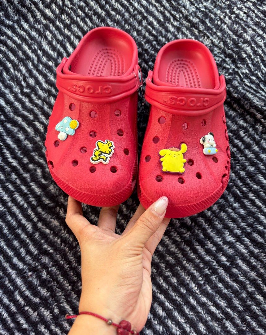 Red Crocs with Charms - Kids Size (Category: Babies & Kids Fashion) located in Digos. Submitted by kathydiane76376 (Listing ID 1463690827, Image 3). Description: - Cute red Crocs for kids - Comes with fun cartoon charms (Winnie the Pooh, Mickey Mouse, Pikachu) - Easy to slip on and off - Great for playtime or casual wear - Perfect for character-loving kids.