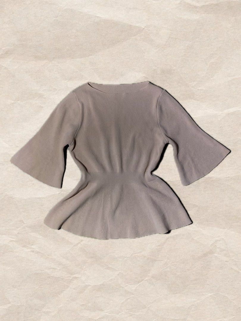 Ribbed Peplum Top with Bell Sleeves (Category: Sleeveless) located in Rizal. Submitted by pcesspscl145 (Listing ID 1463664478, Image 1). Description: - Lightweight ribbed knit fabric - Flattering peplum silhouette - Elegant flared bell sleeves - Classic round neckline - Cinched waist for a feminine shape - Perfect for dressing up or down.