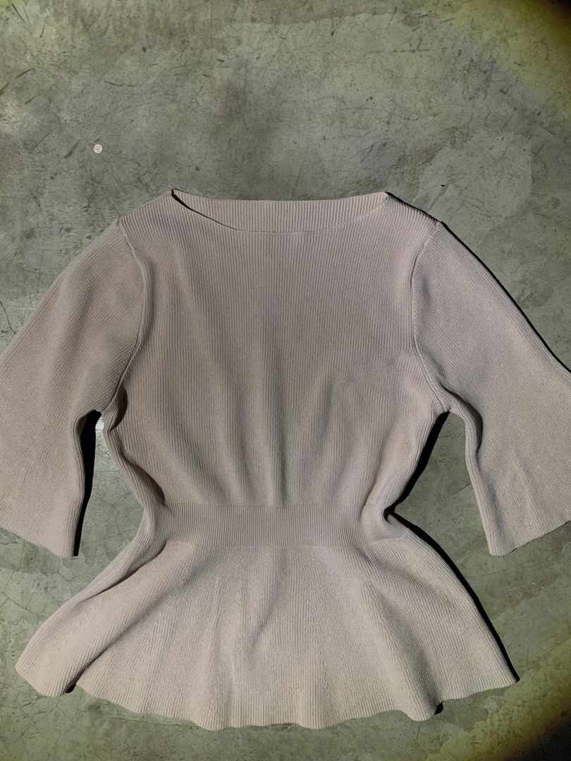Ribbed Peplum Top with Bell Sleeves (Category: Sleeveless) located in Rizal. Submitted by pcesspscl145 (Listing ID 1463664478, Image 3). Description: - Lightweight ribbed knit fabric - Flattering peplum silhouette - Elegant flared bell sleeves - Classic round neckline - Cinched waist for a feminine shape - Perfect for dressing up or down.