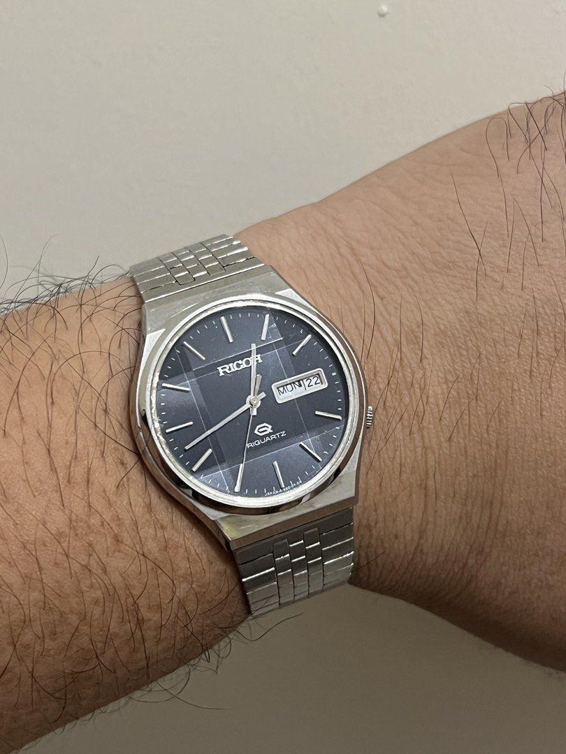 Ricoh Riquartz Blue Dial Day-Date Watch – Ref. 580003 (Category: Men's Watches) located in Quezon City. Submitted by bobby.brown. (Listing ID 1463667283, Image 3). Description: Ricoh Riquartz Blue Dial Day-Date Watch – Ref. 580003 Estimated BMBY: August 1980 An exceptional vintage Japanese quartz dress watch by Ricoh, featuring a sleek, integrated stainless steel case paired with its original multi-link Jubilee-style bracelet. The sharp blue dial