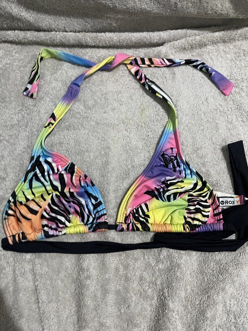 Roxy Rainbow Zebra Print Bikini Top (Category: Bikinis & Swimsuits) located in Manila. Submitted by miss.arpee (Listing ID 1463688912, Image 1). Description: - Roxy bikini top - Eye-catching rainbow and zebra print - Halter neck with adjustable tie closures - Black band along the bottom for a secure fit - Ideal for beach, pool, or vacation - Versatile for mixing and matching with different bikini bottoms 📌brand: Roxy and mixed brands 📌condition