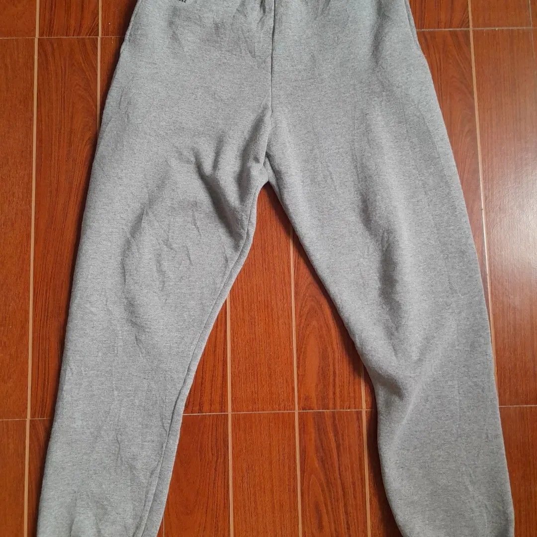 Russell Athletic Grey Sweatpants Size S/CH (Category: Joggers) located in Manila. Submitted by goldrugs (Listing ID 1463573329, Image 1). Description: - Grey sweatpants from Russell Athletic - Elastic waistband with drawstring - Made in Honduras - Cotton/Polyester blend - Comfortable for lounging or workouts - Size S/CH.