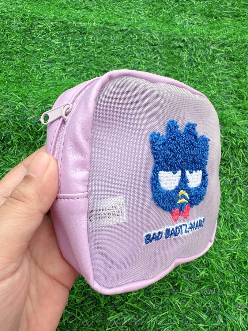 Sanrio Badtz-Maru Embroidered Pouch (Category: Purses & Pouches) located in Manila. Submitted by ronoarabbit.ph (Listing ID 1463575689, Image 2). Description: - Adorable purple pouch featuring Badtz-Maru embroidery. - Convenient mesh front panel. - Secure zipper closure. - Interior label reads '5th Anniversary HAPIDANBU'. - Ideal for storing small essentials and knick-knacks. 📌Payment First Policy, NO COD 📌 First to pay, no long reservations 📍