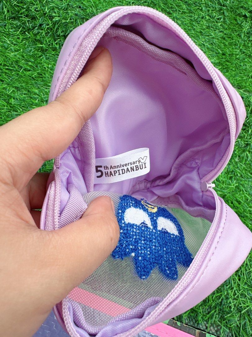 Sanrio Badtz-Maru Embroidered Pouch (Category: Purses & Pouches) located in Manila. Submitted by ronoarabbit.ph (Listing ID 1463575689, Image 3). Description: - Adorable purple pouch featuring Badtz-Maru embroidery. - Convenient mesh front panel. - Secure zipper closure. - Interior label reads '5th Anniversary HAPIDANBU'. - Ideal for storing small essentials and knick-knacks. 📌Payment First Policy, NO COD 📌 First to pay, no long reservations 📍