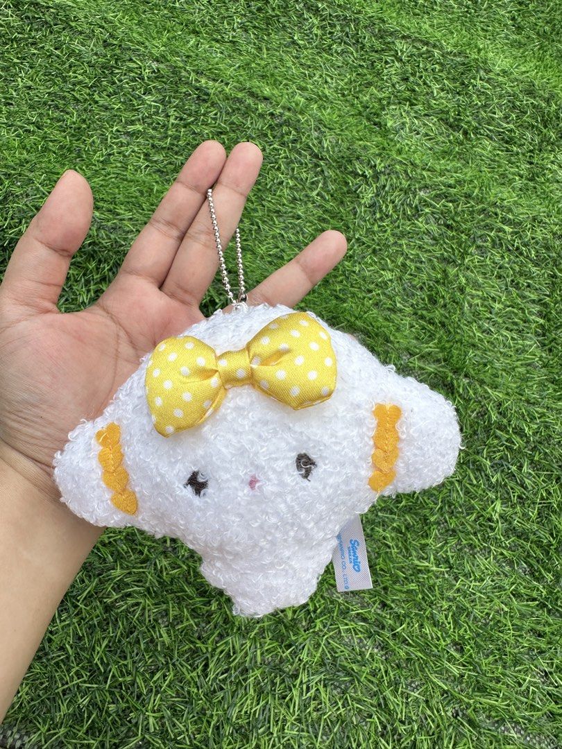 Sanrio Cogimyun Plush Keychain with Yellow Bow (Category: Plushies & Soft Toys) located in Manila. Submitted by ronoarabbit.ph (Listing ID 1463670977, Image 1). Description: - Cogimyun plush keychain - Soft, white, fluffy material - Features a cute yellow polka dot bow - Comes with a durable metal chain for keys or bags - Brand new, original packaging intact - A must-have for any Sanrio fan! 📌Payment First Policy, NO COD 📌 First to pay, no long
