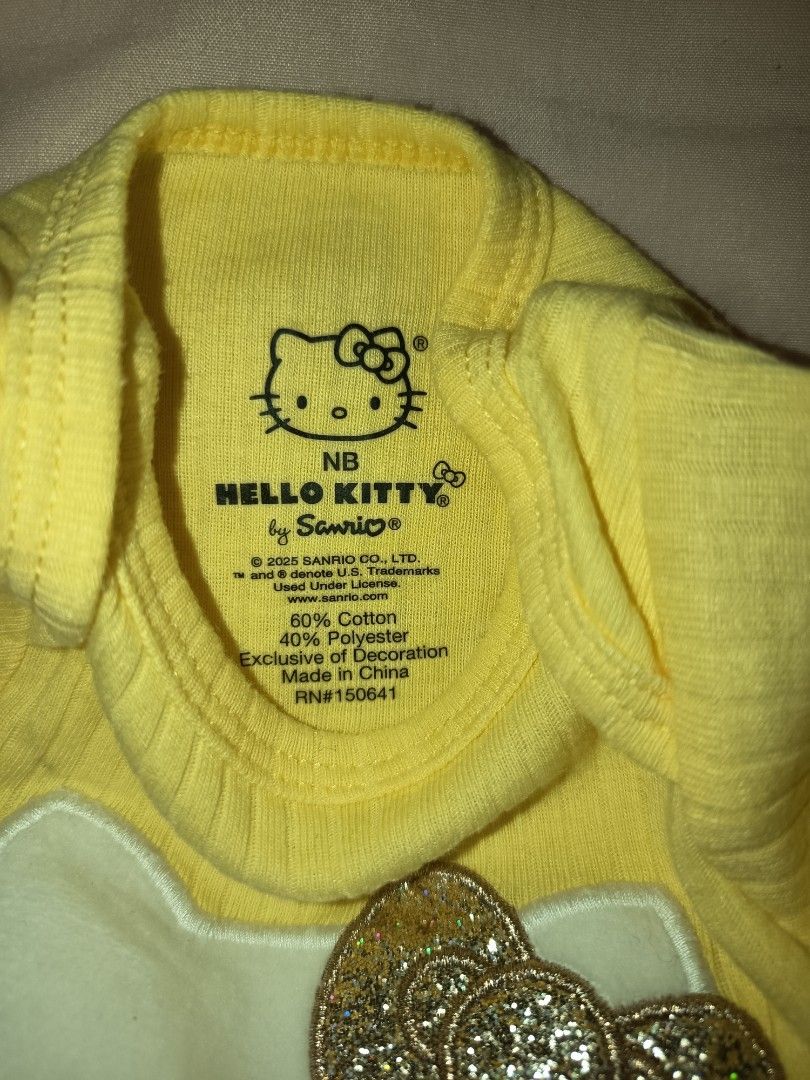 Sanrio Hello Kitty Onesie NB (Category: Babies & Kids Fashion) located in Jose Panganiban. Submitted by louisecheese (Listing ID 1463575101, Image 3). Description: -USED ONCE ONLY (Big baby sikip agad) - Adorable yellow Kitty onesie - Comfortable short sleeves - Soft cotton blend fabric - Easy snap closure at the bottom - Ideal for everyday wear or as a gift.