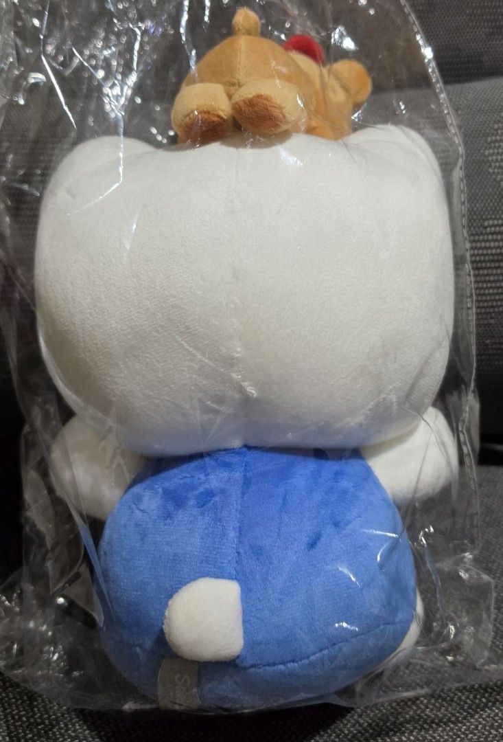 Sanrio Hello Kitty Plush Toy with Bear Charm (Category: Plushies & Soft Toys) located in Taytay. Submitted by king_ayamiku (Listing ID 1463715658, Image 2). Description: - Adorable Kitty plush toy - Features blue overalls and a cute bear charm on her head - Brand new, still in original packaging - Perfect for Kitty collectors and Sanrio fans - Great for display or as a thoughtful gift.