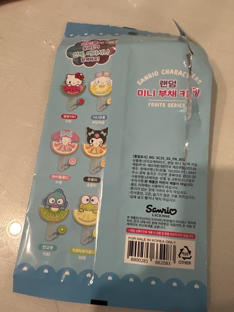 Sanrio Mini Fruit Series - Fan keyring (Category: Character Goods) located in Manila. Submitted by lunalux09 (Listing ID 1463579149, Image 2). Description: - Sanrio Characters Random Mini Fan Keychain - Fruits Series design - Features My Melody with a grapefruit motif - Perfect accessory for bags, backpacks, or keys - Comes with a small chain - Includes a cute lemon charm - Ideal gift for Sanrio collectors and fans.