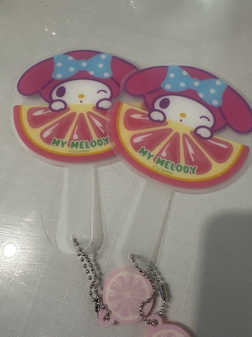 Sanrio Mini Fruit Series - Fan keyring (Category: Character Goods) located in Manila. Submitted by lunalux09 (Listing ID 1463579149, Image 1). Description: - Sanrio Characters Random Mini Fan Keychain - Fruits Series design - Features My Melody with a grapefruit motif - Perfect accessory for bags, backpacks, or keys - Comes with a small chain - Includes a cute lemon charm - Ideal gift for Sanrio collectors and fans.