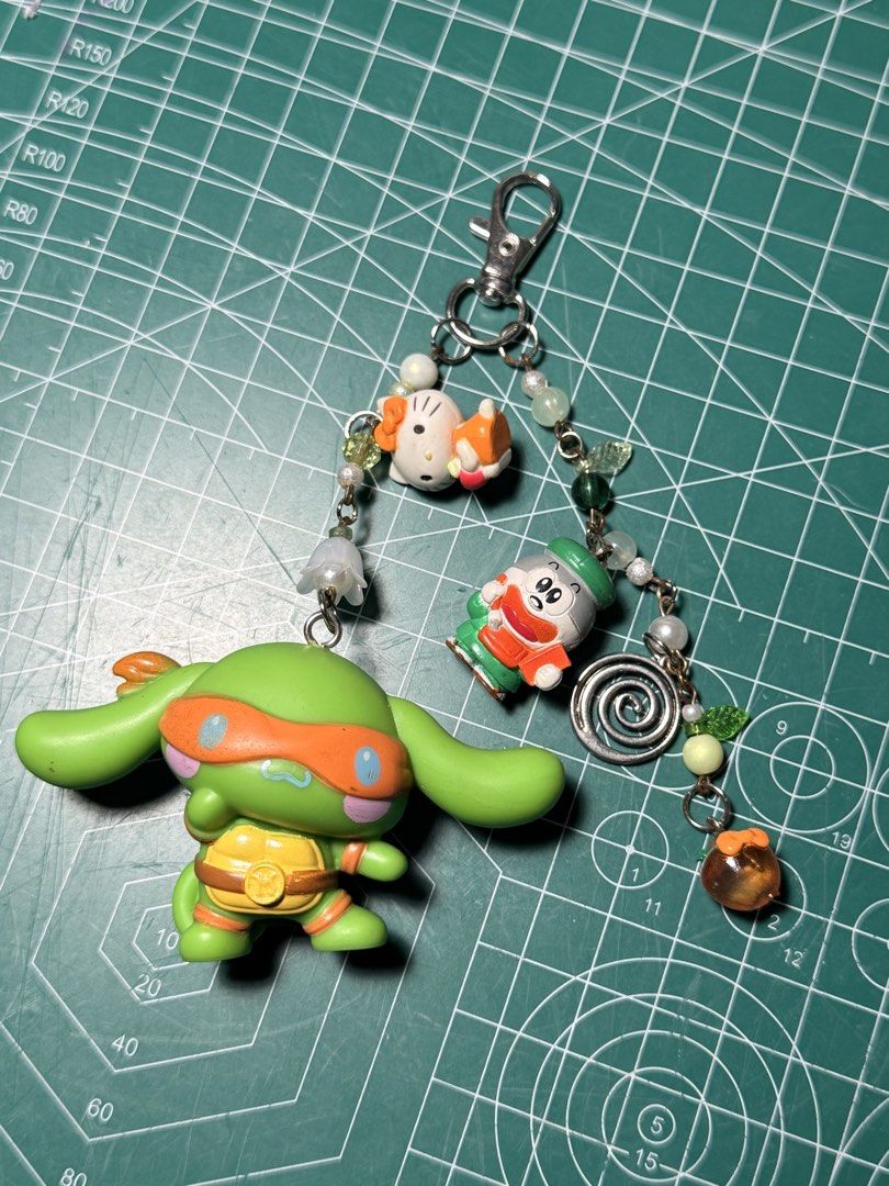 sanrio x ninja turtles mcdo toy (Category: Character Goods) located in Baguio. Submitted by nothingphil (Listing ID 1463721776, Image 1). Description: - cinnamoroll x michael angelo - turned it into a keychain and added some charms i got from the japan surplus - name your price po rfs: decluttering.