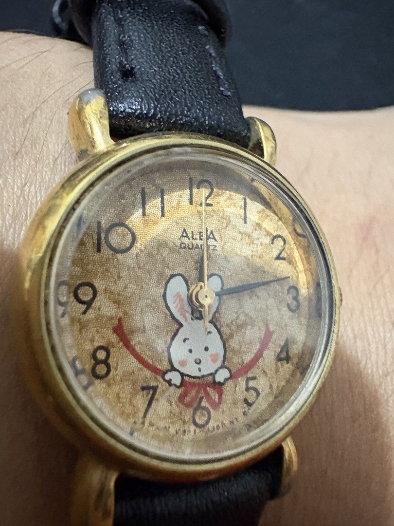 Seiko Alba Quartz (Category: Women's Watches) located in Quezon City. Submitted by rentoti (Listing ID 1463568456, Image 1). Description: - Brand: Seiko Alba - Movement: Quartz - Design: Features a charming bunny graphic on the dial - Case: Gold-tone - Strap: Black leather - Condition: Pre-loved, with visible signs of wear - Origin: Japan (as indicated on the case back).