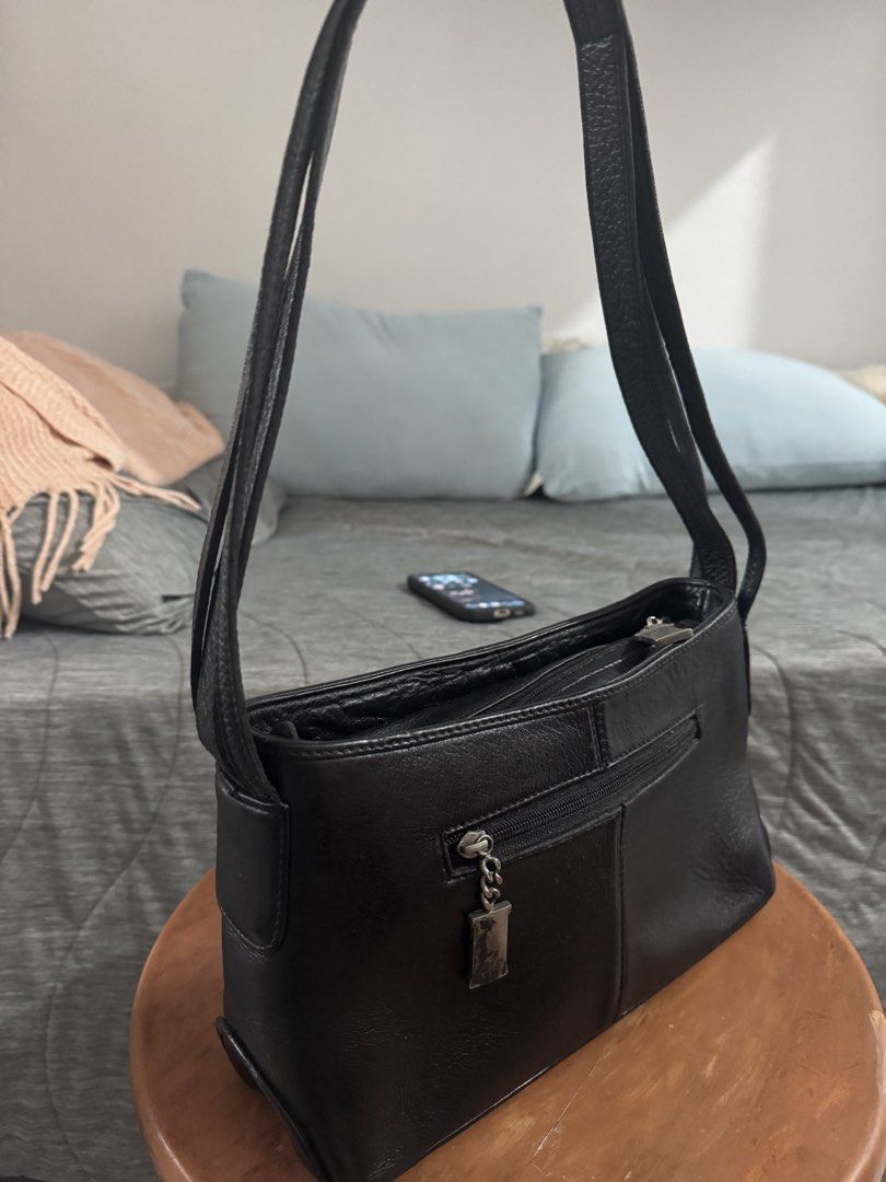 Sergio Rossi Black Leather Shoulder Bag (Category: Luxury Bags & Wallets) located in Las Pinas. Submitted by megalleon8 (Listing ID 1463705310, Image 3). Description: - Genuine black leather shoulder bag, short triple leather straps - Brand: Sergio Rossi - No flaws outside, just a little bit dirty inside, in perfect condition even if in storage since the leather is of excellent quality.