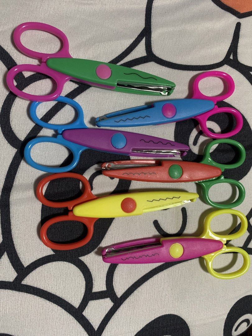 Set of 6 Decorative Edge Craft Scissors (Category: Craft Supplies & Tools) located in Manila. Submitted by bev88 (Listing ID 1463646945, Image 1). Description: - Set of 6 decorative edge craft scissors - Perfect for scrapbooking, card making, and DIY projects - Each pair features a different wavy edge design - Assorted vibrant colors: green, blue, purple, red, yellow, and pink - Ideal for creating unique and decorative borders on paper crafts.