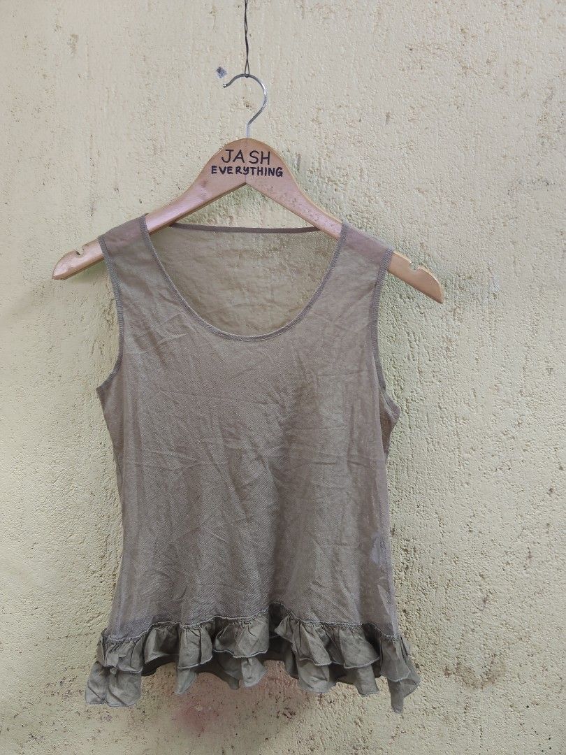 Sheer Ruffle Hem Sleeveless Top (Category: Sleeveless) located in City of Isabela. Submitted by jasheverything (Listing ID 1463639870, Image 1). Description: - Lightweight sheer fabric - Scoop neckline - Sleeveless design - Cute ruffle hem detail - Subtle shimmer in fabric - Versatile for layering or wearing on its own - Easy to style Very Good Condition 350+SF.